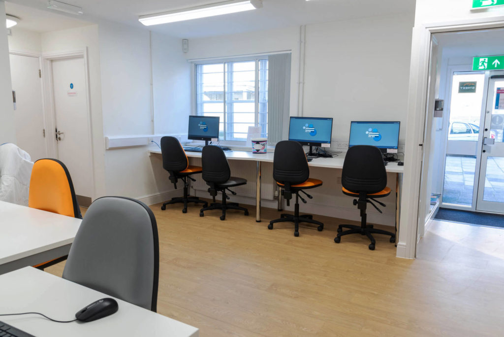 Public access computer area at Street Library with desktop workstations, study desks, adjustable seating and space for internet access, learning and online services.