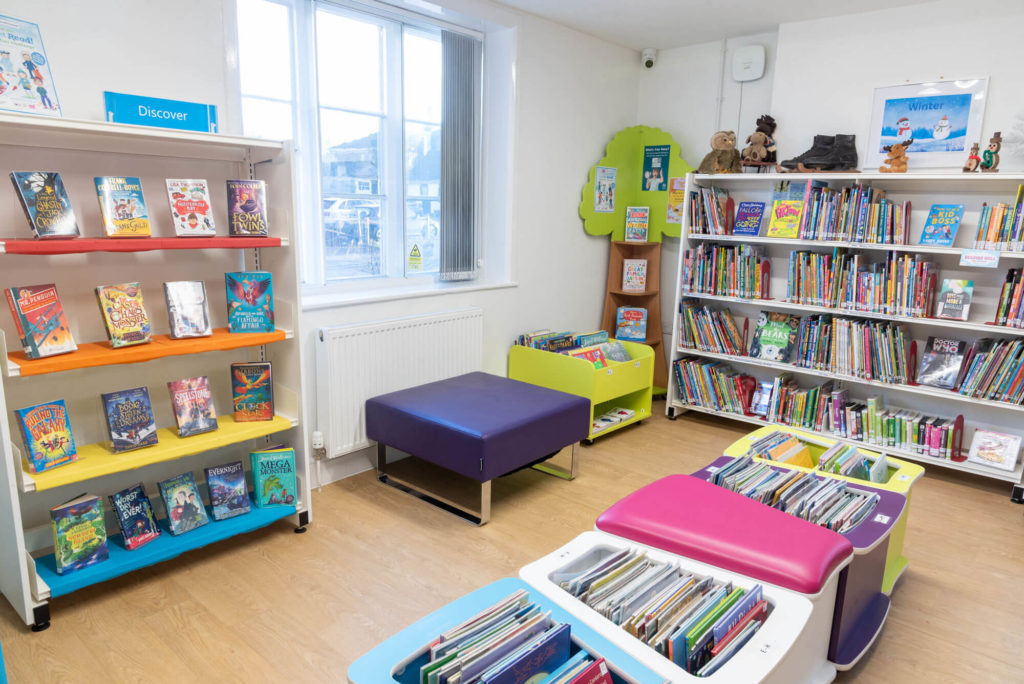 Children's area at Street Library with colourful book displays, low-level browsing shelves, children's book collections and seating for reading and learning.