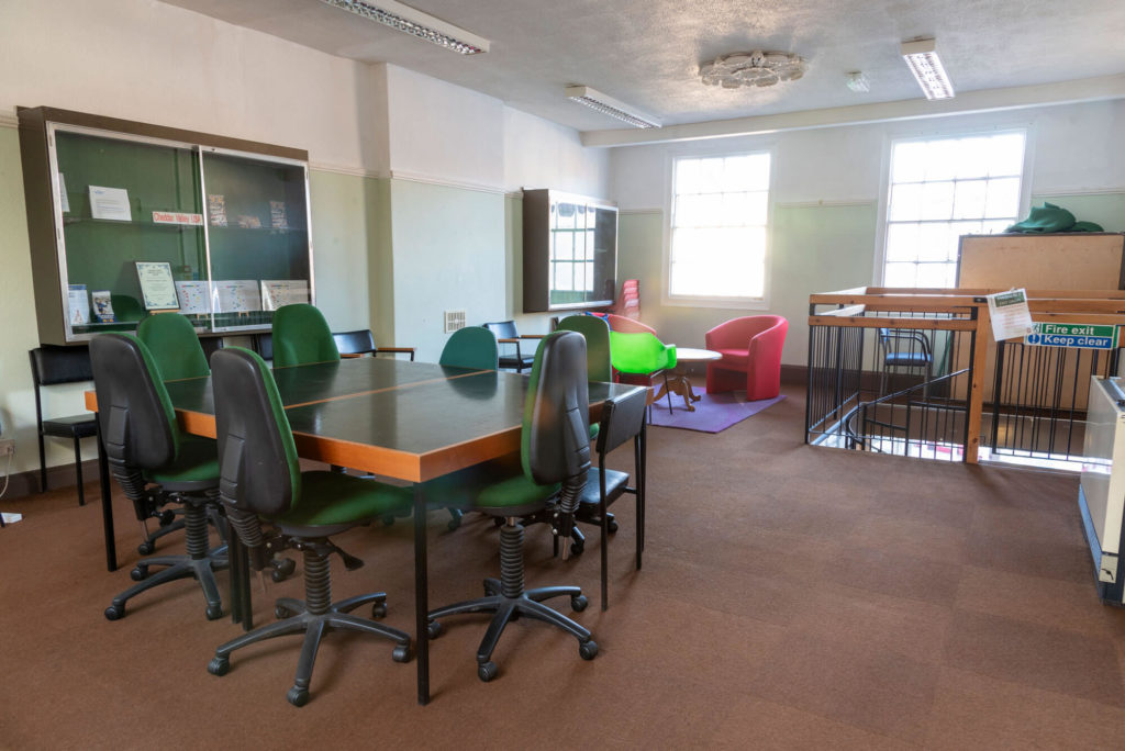 Study and meeting area at Cheddar Library with desks, seating and a quiet space for reading, learning and group work.