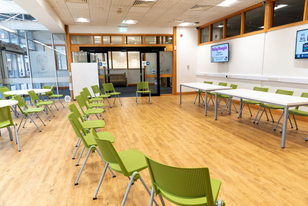 Community meeting and event space at Taunton Library with flexible seating, tables, presentation screens and room for library activities, workshops and group sessions.