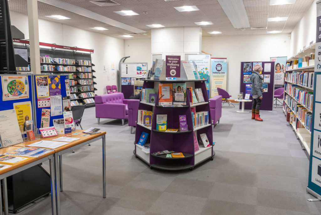 Health and wellbeing area at Taunton Library with wellbeing book collections, information displays, comfortable seating and dedicated space for health information.