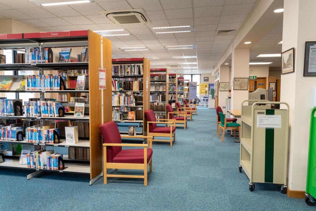 Adult lending area at Yeovil Library with extensive travel, history and reference collections, comfortable seating and wide aisles for browsing, reading and study.