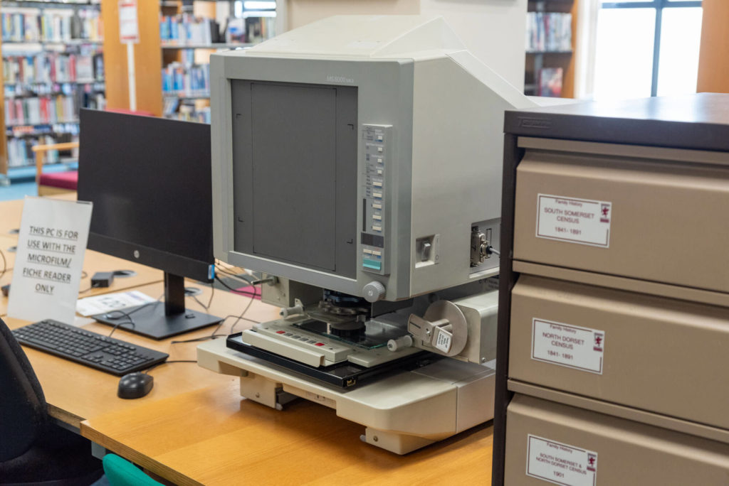 Microfilm reader and local history archive equipment at Yeovil Library, providing access to historical census records, newspapers and family history resources.
