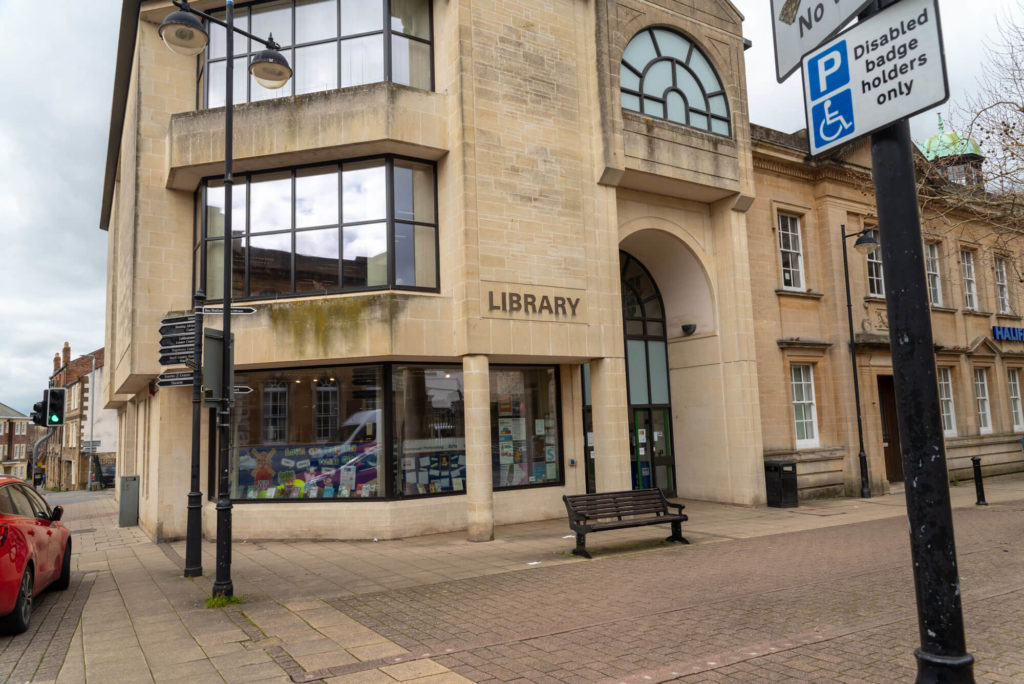 Main entrance area at Yeovil Library, showing the library building, entrance doors, windows and surrounding pavement.