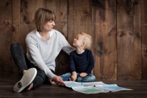 Mother and toddler using a map potograph