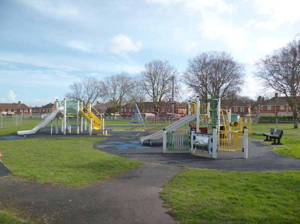 Play area with slides and climbing frame