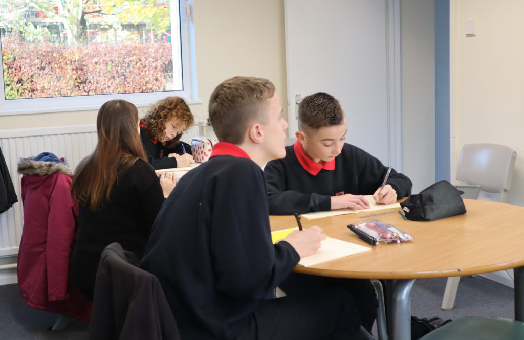 Pupils learning in a classroom