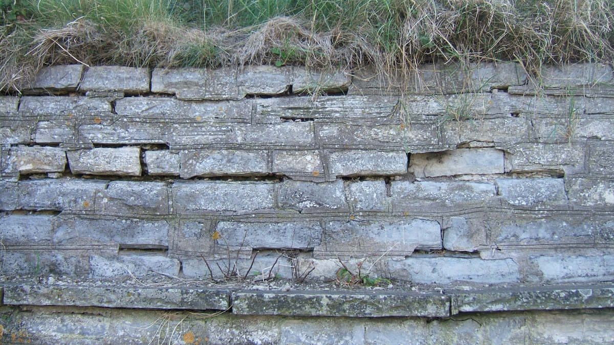 Photo of a weathered stone wall
