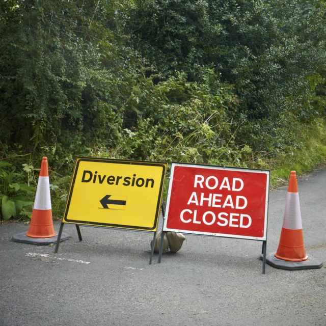 picture of road ahead closed and diversion signs