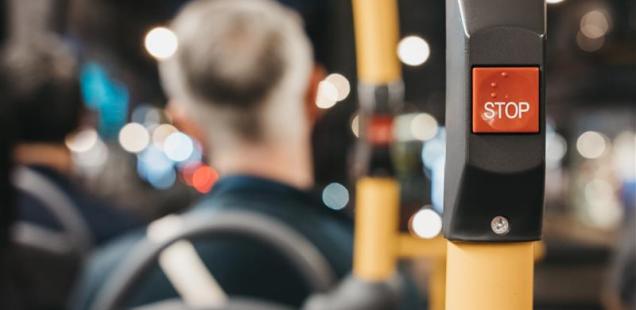 A stop button on a bus