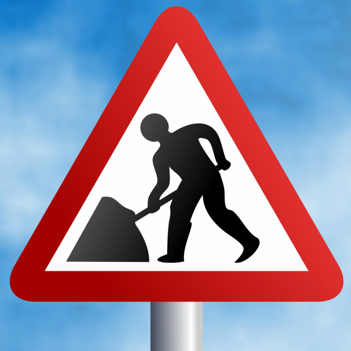 Triangular roadworks sign