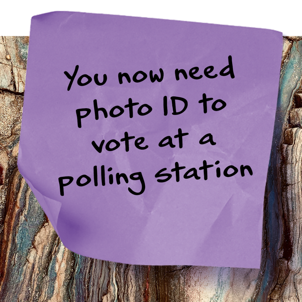 Post it note image saying you need photo ID to vote