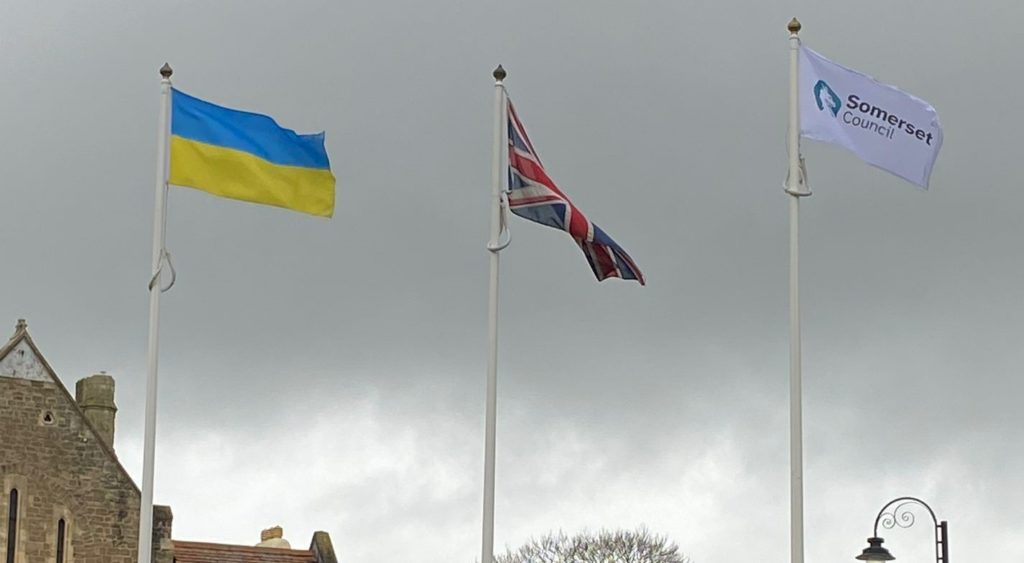 Image of a Ukraine flag, British flag and Somerset Council flag