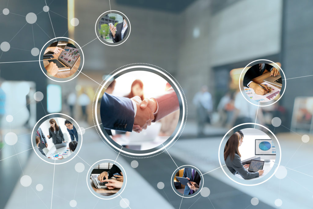 Business network concept image. Interconnected circles with images handshake image, photos of graphs and images of business people with a blurred background.