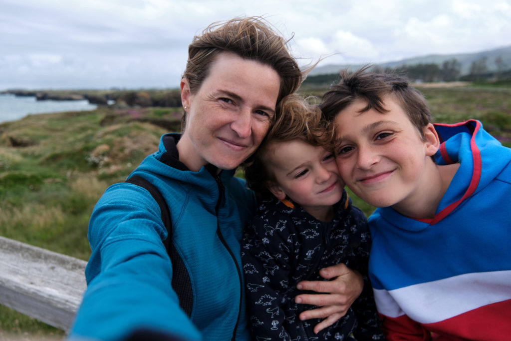 Foster family taking a coastal selfie