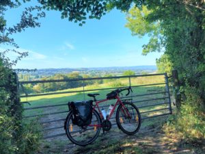 image of the cycle way in the distance with a bike lent against a gate