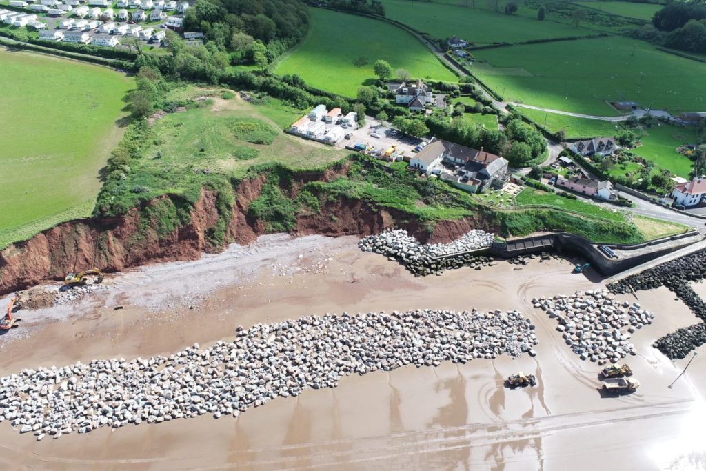 aerial view of rocks delivered to the beach