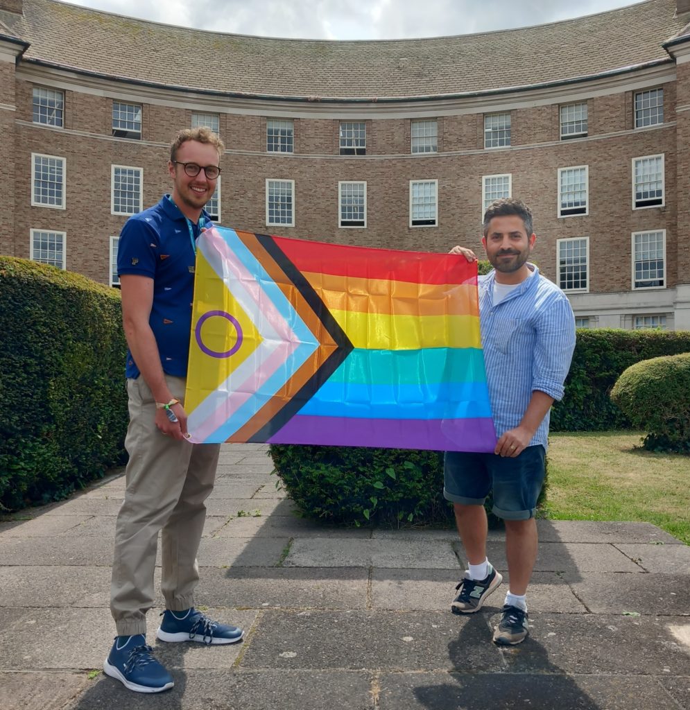 Councillor Adam Dance and Councillor Diogo Rodrigues with the Progress Pride flag