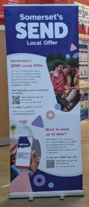 Vertical roller banner with SEND Partnership logo at top, description of contents of Somerset's SEND Local Offer and QR codes to go to the Local Offer website and sign up for the regular SEND News email bulletin.