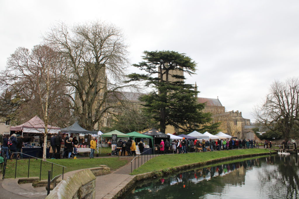 Image of Christmas stalls by a river 