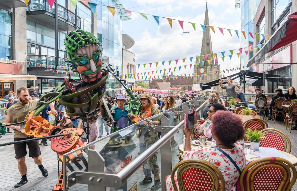 Eko the giant puppet entertaining the public.