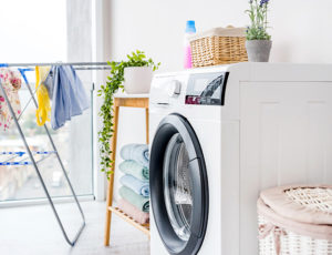 A washing machine in a laundry room