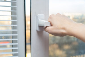 Someone holding a window handle