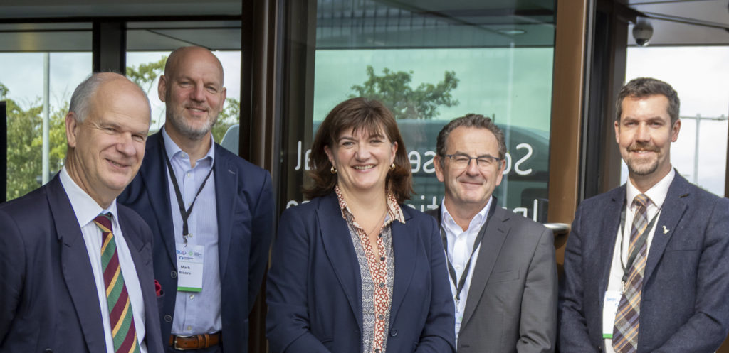 Picture shows PCC Mark Shelford, Mark Moore, Director Cyber Resilience Centre for the South West, Baroness Nicky Morgan, Paul Coles, CEO South West Business Council, Mickey Green, Executive Director of Climate and Place, Somerset Council. All stood outside the new FCDI building.