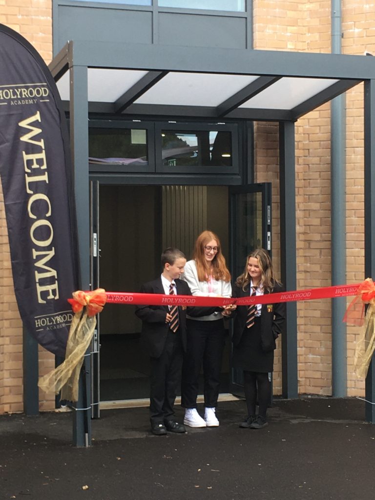 The eldest and youngest pupils of Holyrood Academy cut the ribbon to mark the opening of the new Bennett Building