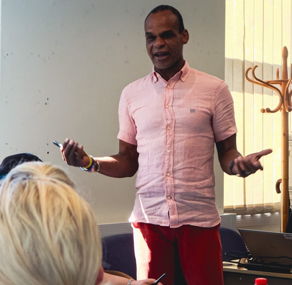 Joseph Olubodun, Peer Mentors and Volunteers Team Lead in a training session