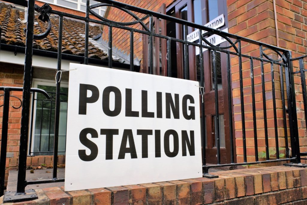 polling station sign outside building