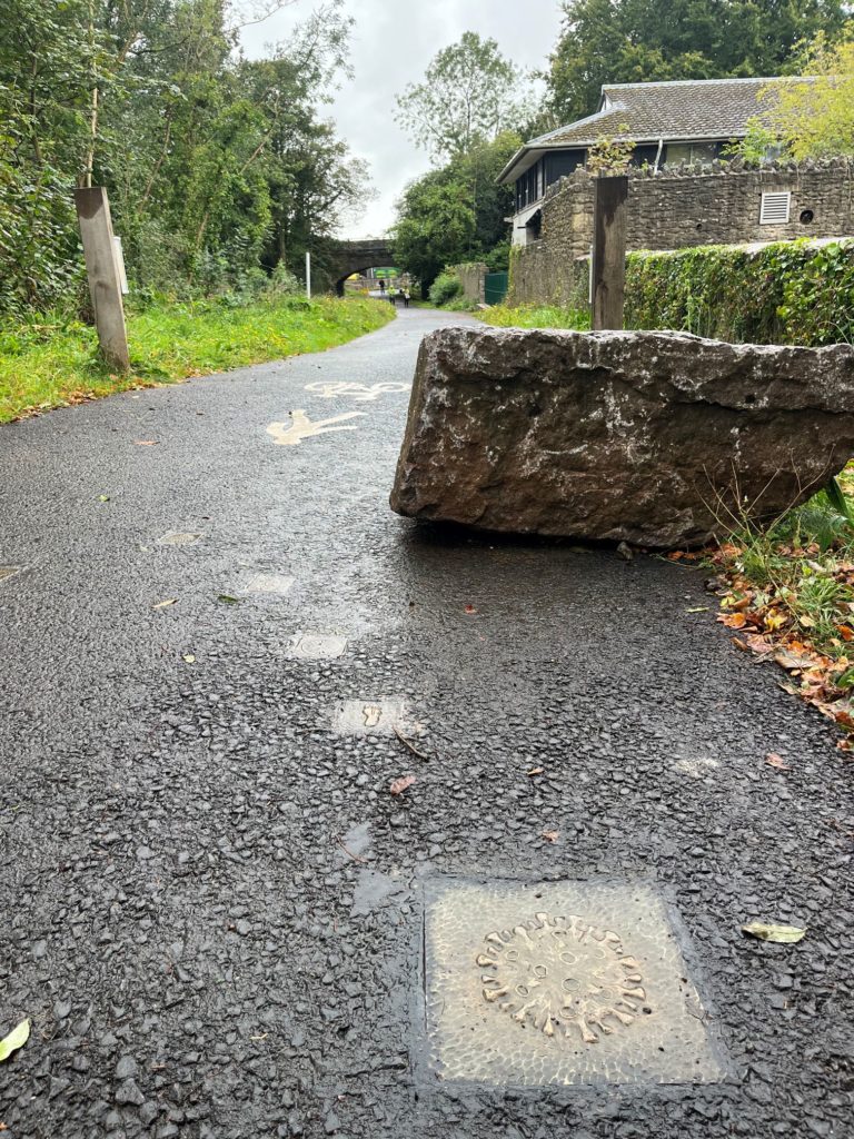 Covid and active travel plaques on multi-user path in Shepton Mallet.