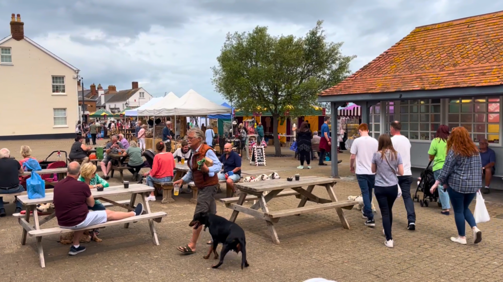 Photo of people relaxing at the market near the harbour in Watchet