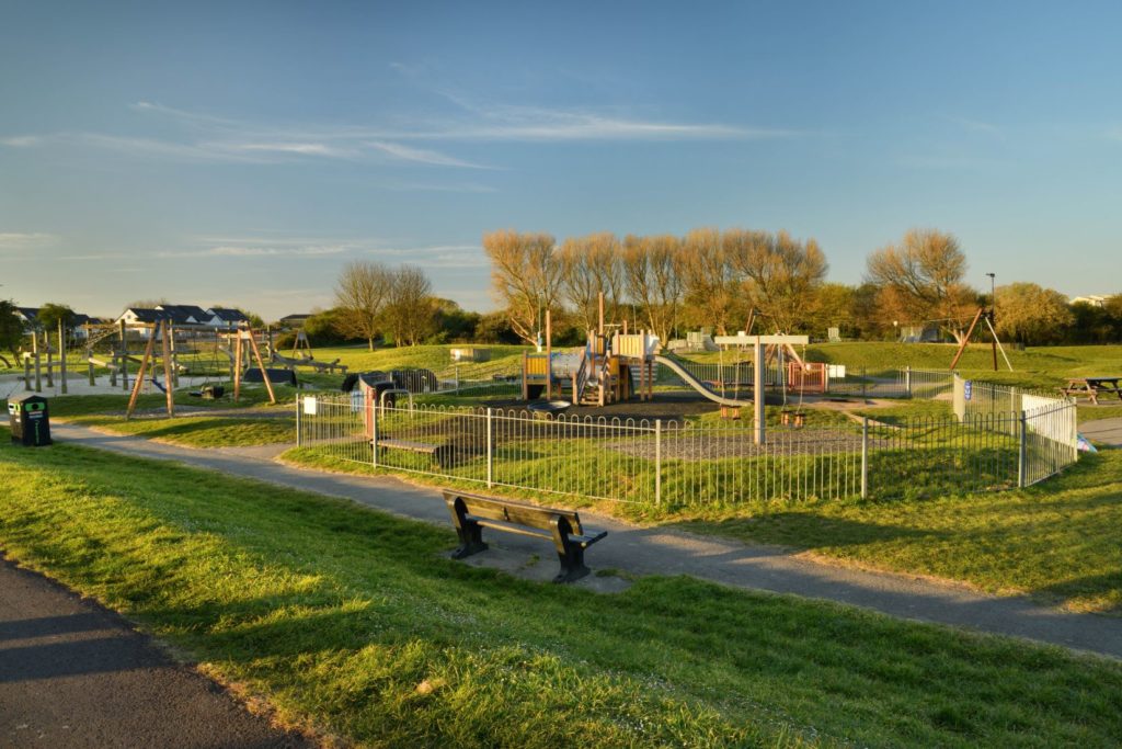 Apex Park Playground with swings and slide