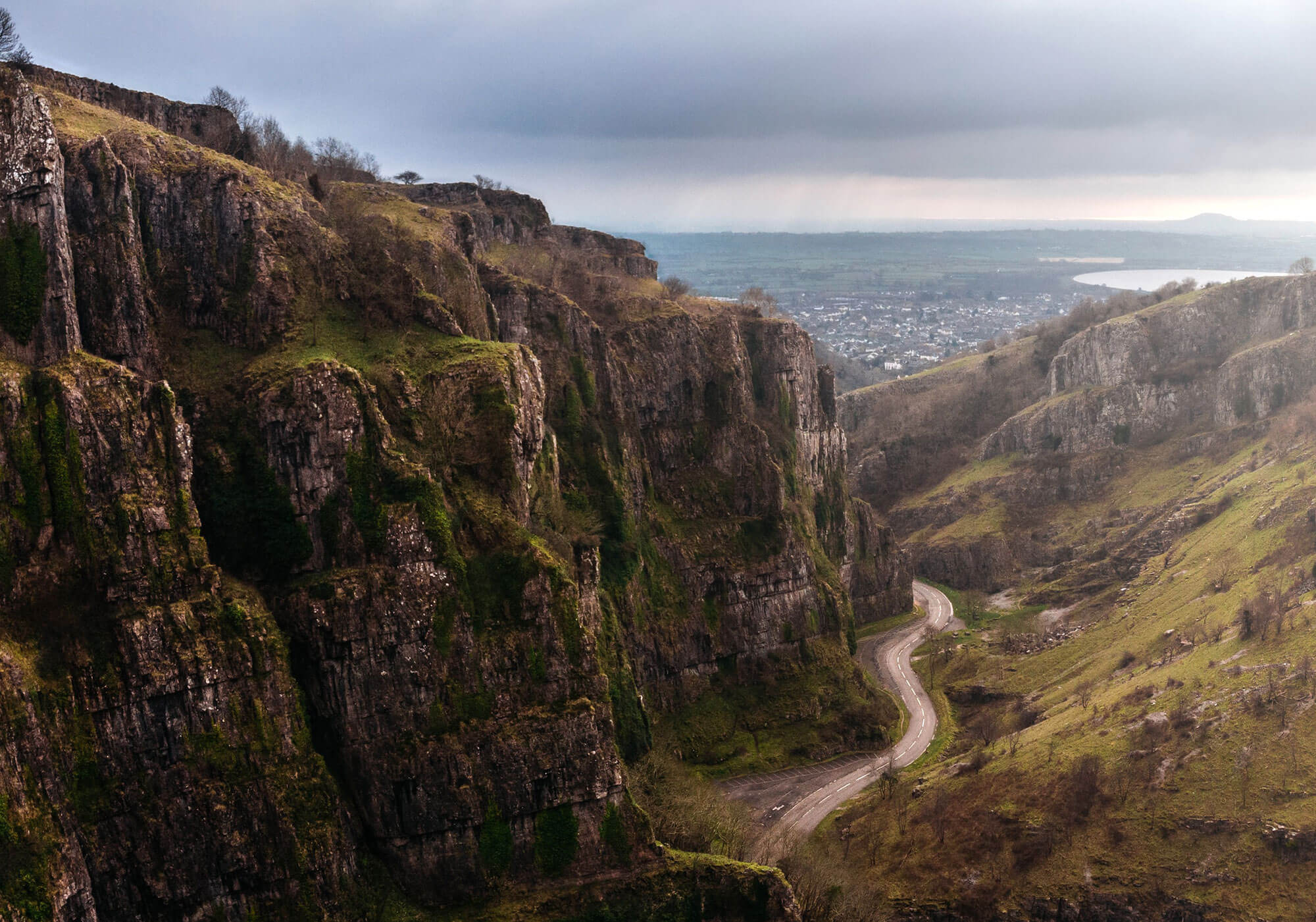 Photograph of a winding road cutting through Cheddar Gorge