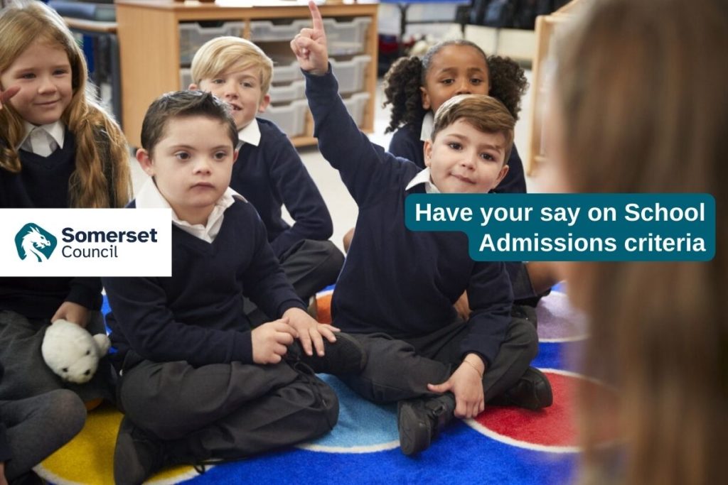 Photo of school pupils sat on a coloured carpet
