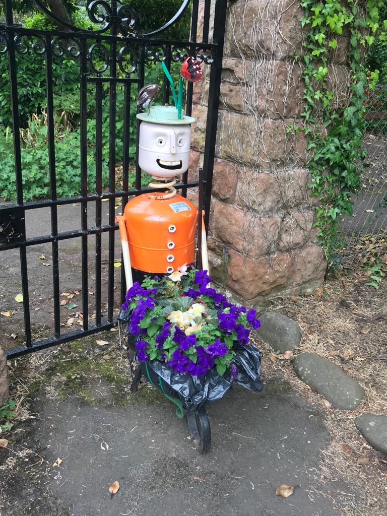 Tin man with flowers