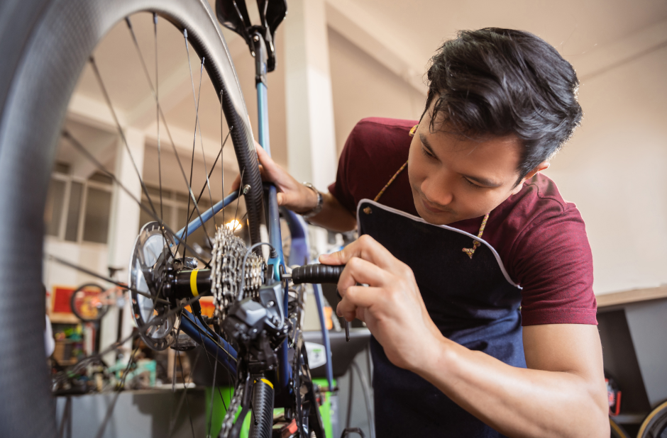 A man repairing a bicycle