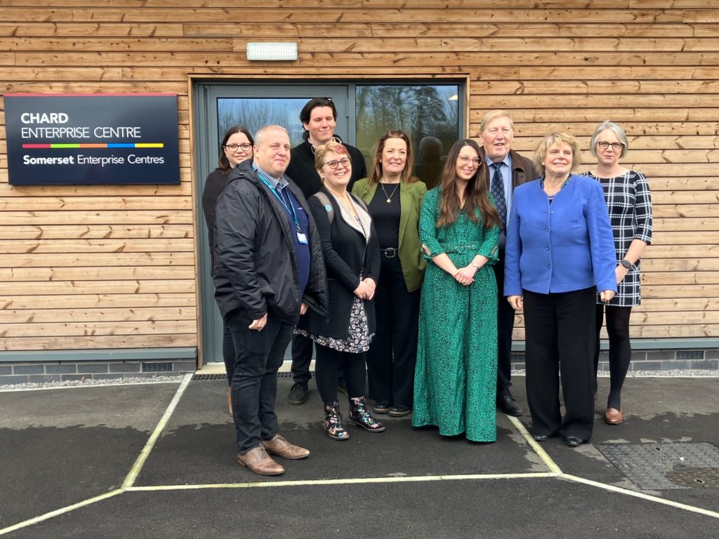 Group photo of Councillors, staff and new tenant outside Chard Enterprise Centre