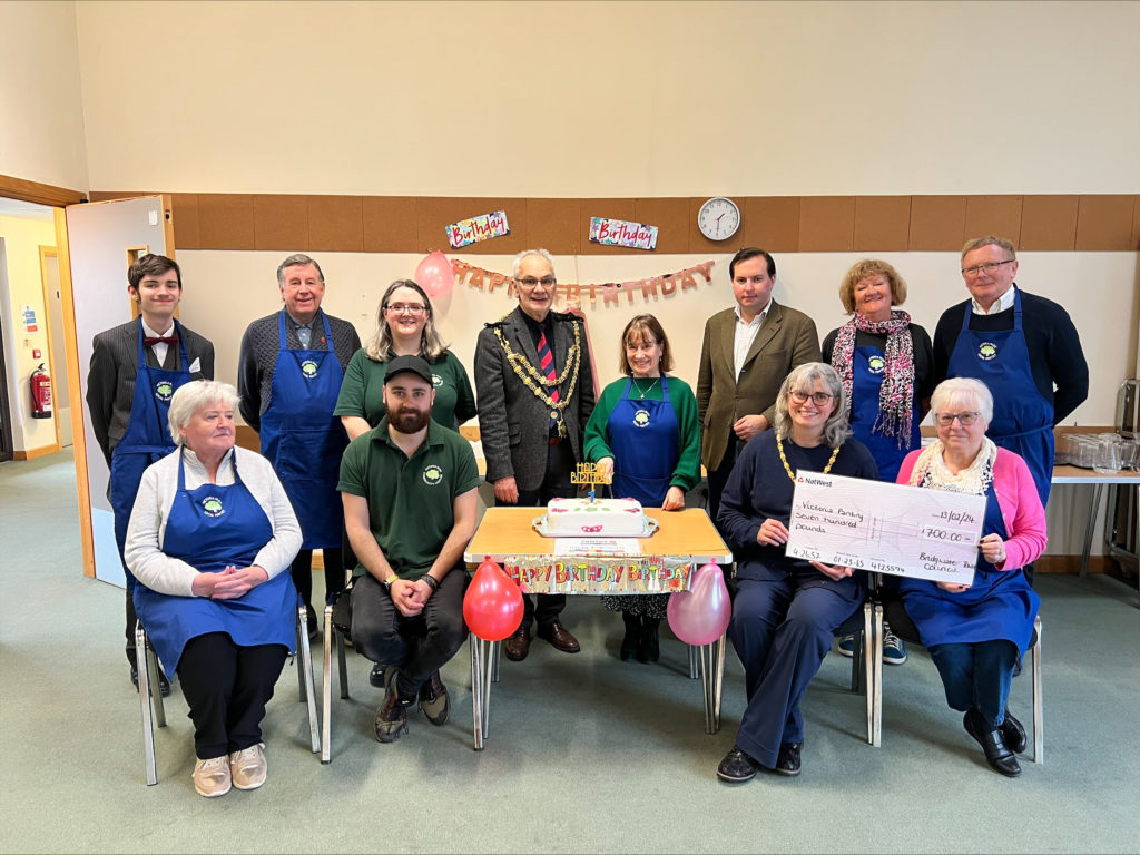 A group shot featuring Cllr Theo Butt Philip, the Mayor and Mayoress of Bridgwater, along with staff and volunteers of the local panty.