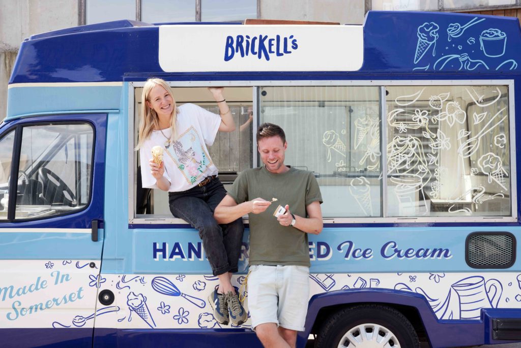 Photograph of customer enjoying an ice cream outside of an ice cream van