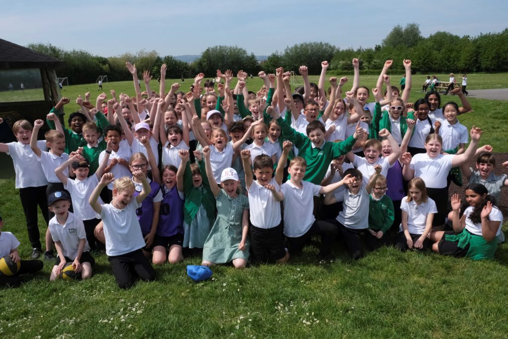 Pupils at Somerset Bridge school celebrate outside.