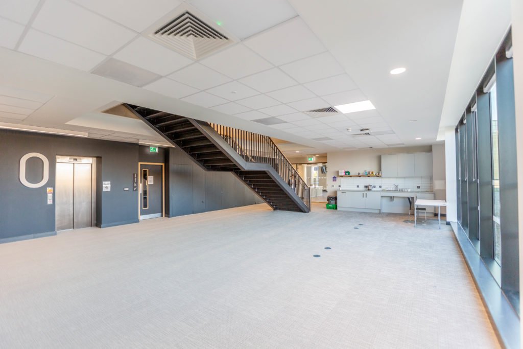 Firepool Centre for Digital Innovation - interior photograph showing a stairwell, elevator and kitchen area