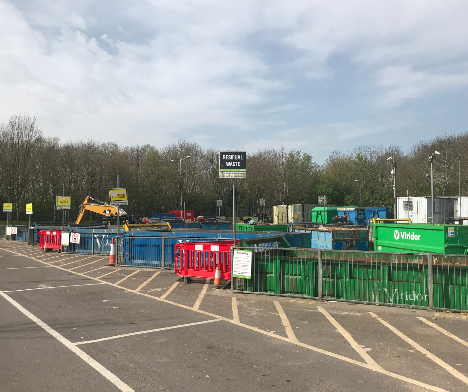 Landscape of Yeovil Recycling Site, featuring parking bays and sorting containers.