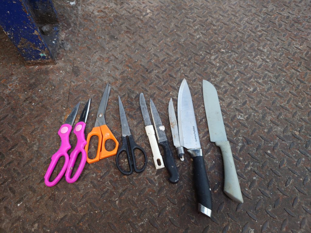 An assortment of knifes and sharp scissors.