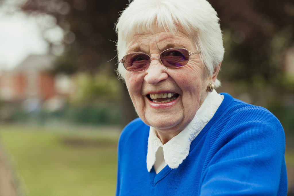 Happy senior woman smiles at the camera.