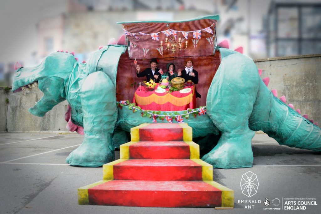 diners at the restaurant inside a dinosaur model with steps leading up to it