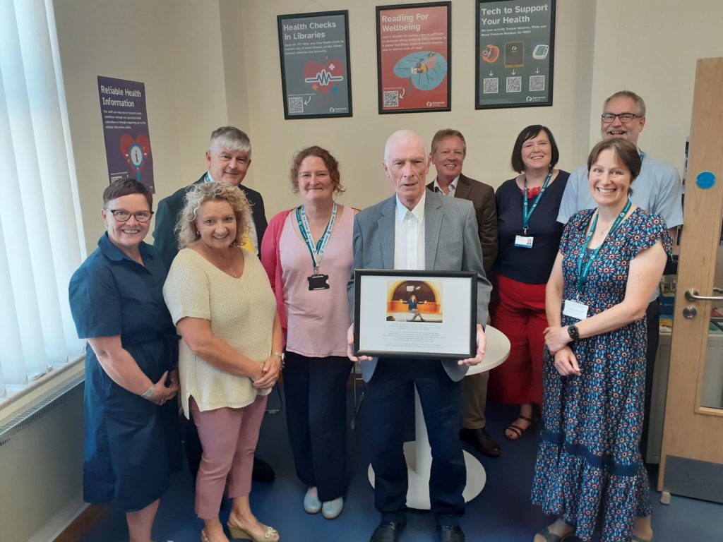 Public Health and libraries staff join Jim Binning at the opening of the Finnis Room at Yeovil Library.