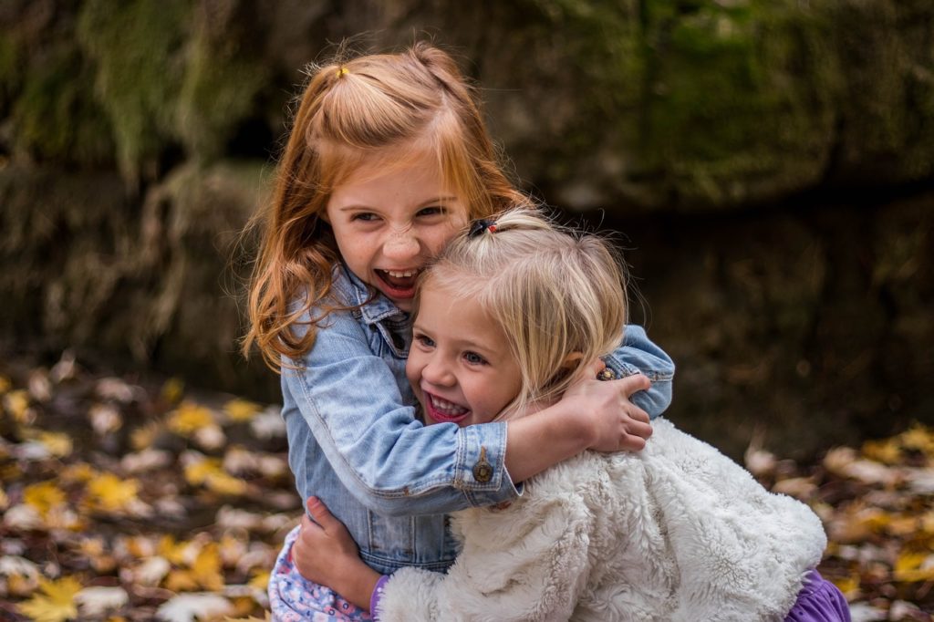 2 young girls hugging
