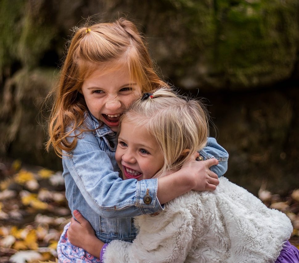 2 young girls hugging